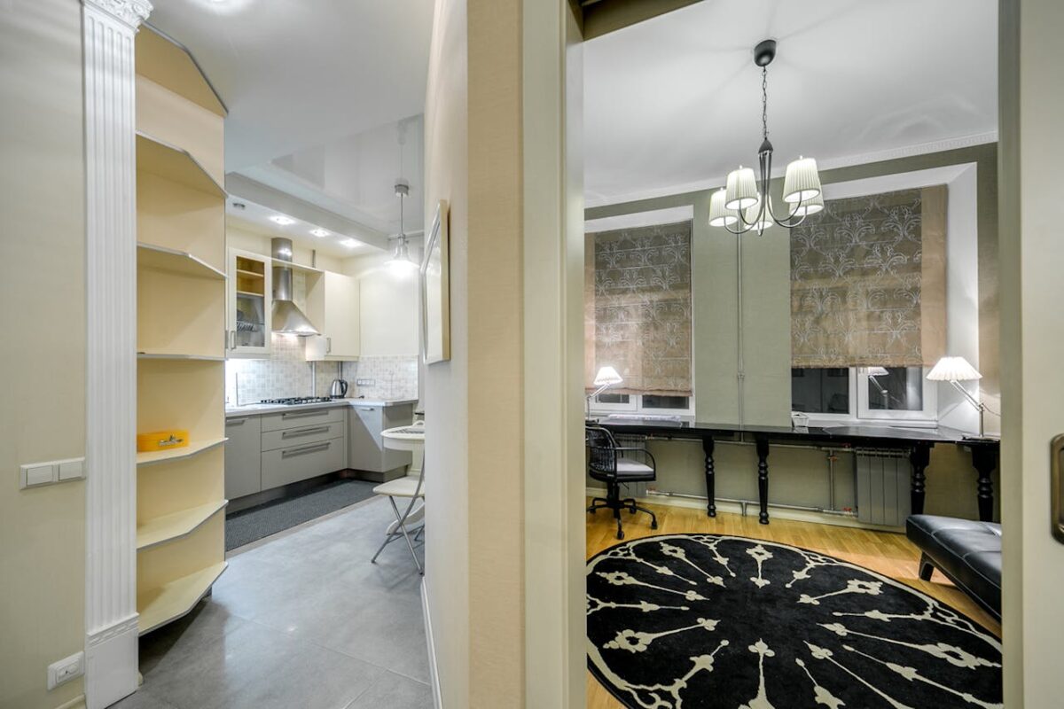 Stylish apartment interior featuring a modern kitchen and elegant office area.